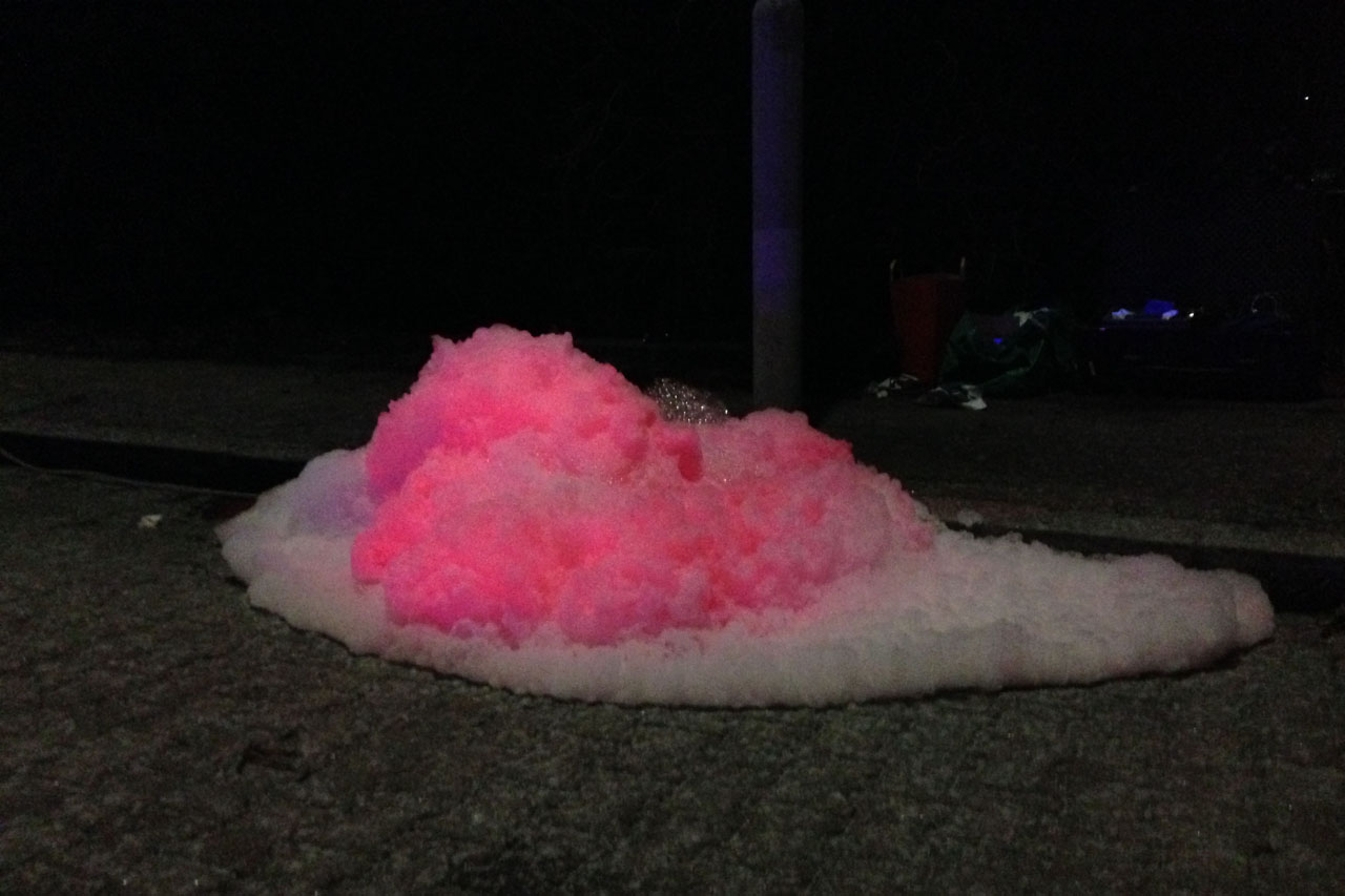 Sewer Foamies. Guerrilla Installation with foam and pink UV active pigments, 2014. Vienna, Austria. Photo: Assocreation.