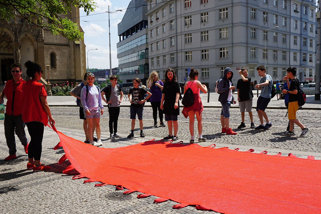 Red Crossing. Participatory public performance. Group exhibition: "Formations", Prague Quadrennial 2019, Strossmayerovo náměstí, Prague, Czech Republic.